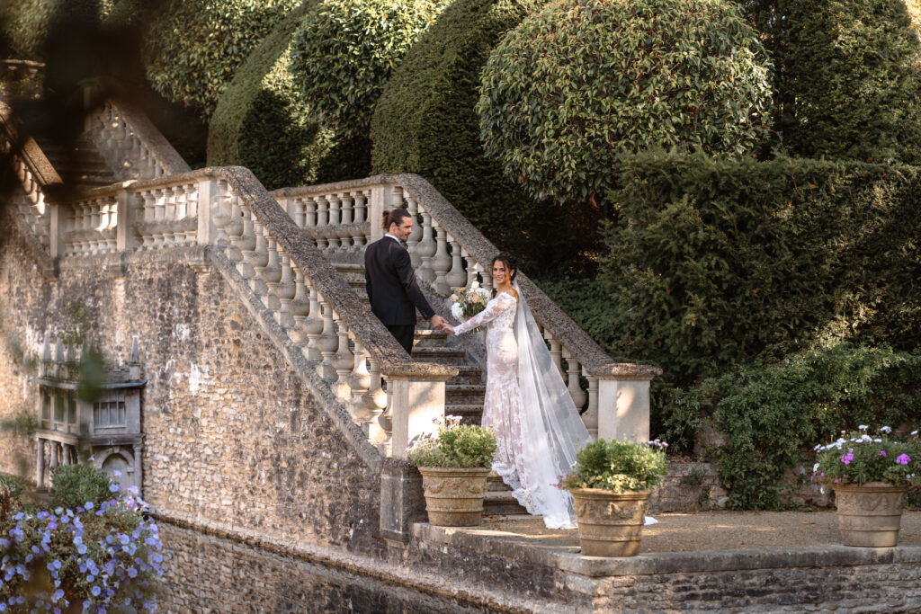 Euridge Manor Editorial Wedding Photographer - Bride and Goom on steps by lake