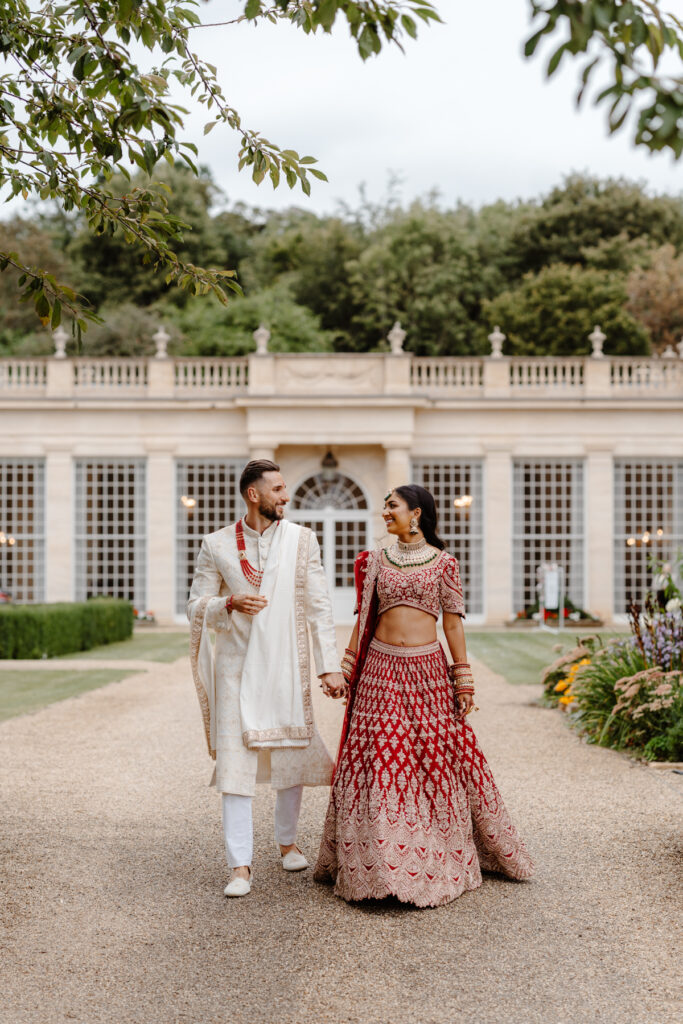 Rushton Hall Fusion Wedding Photography traditional Hindu ceremony traditional red lehenga