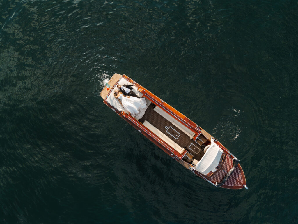 Lake Como Wedding Photographer - Lake Como golden hour boat ride drone photography