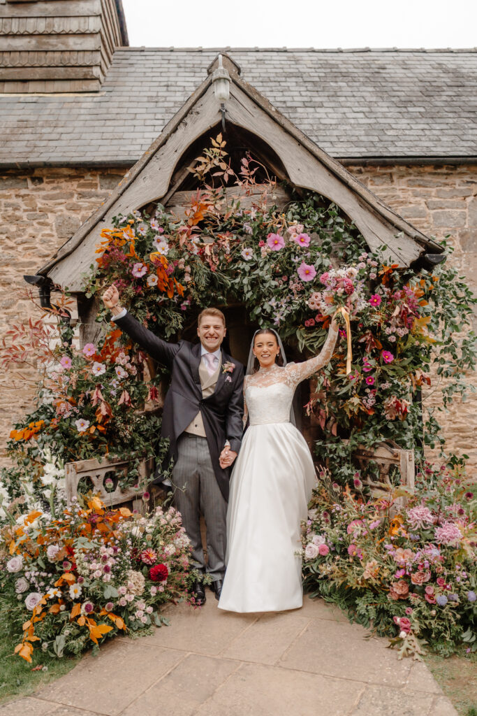 Dewsall Court Wedding - Church Wedding Florals with Bride & Groom